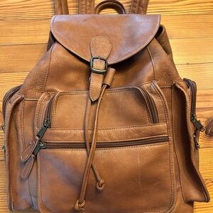 Tan Leather Drawstring Backpack with Front Zip Pockets